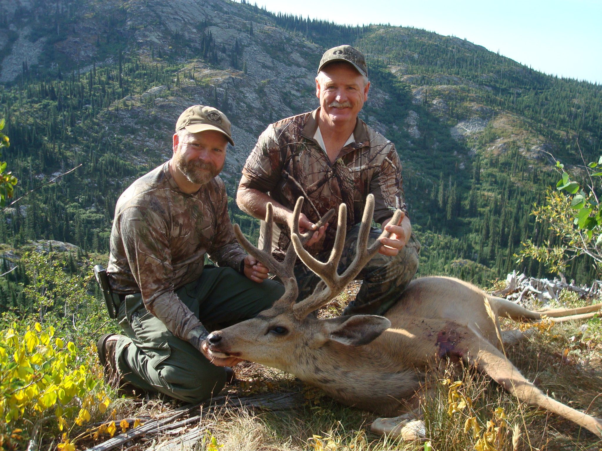 Sam and Mark with a beautiful mule deer buck