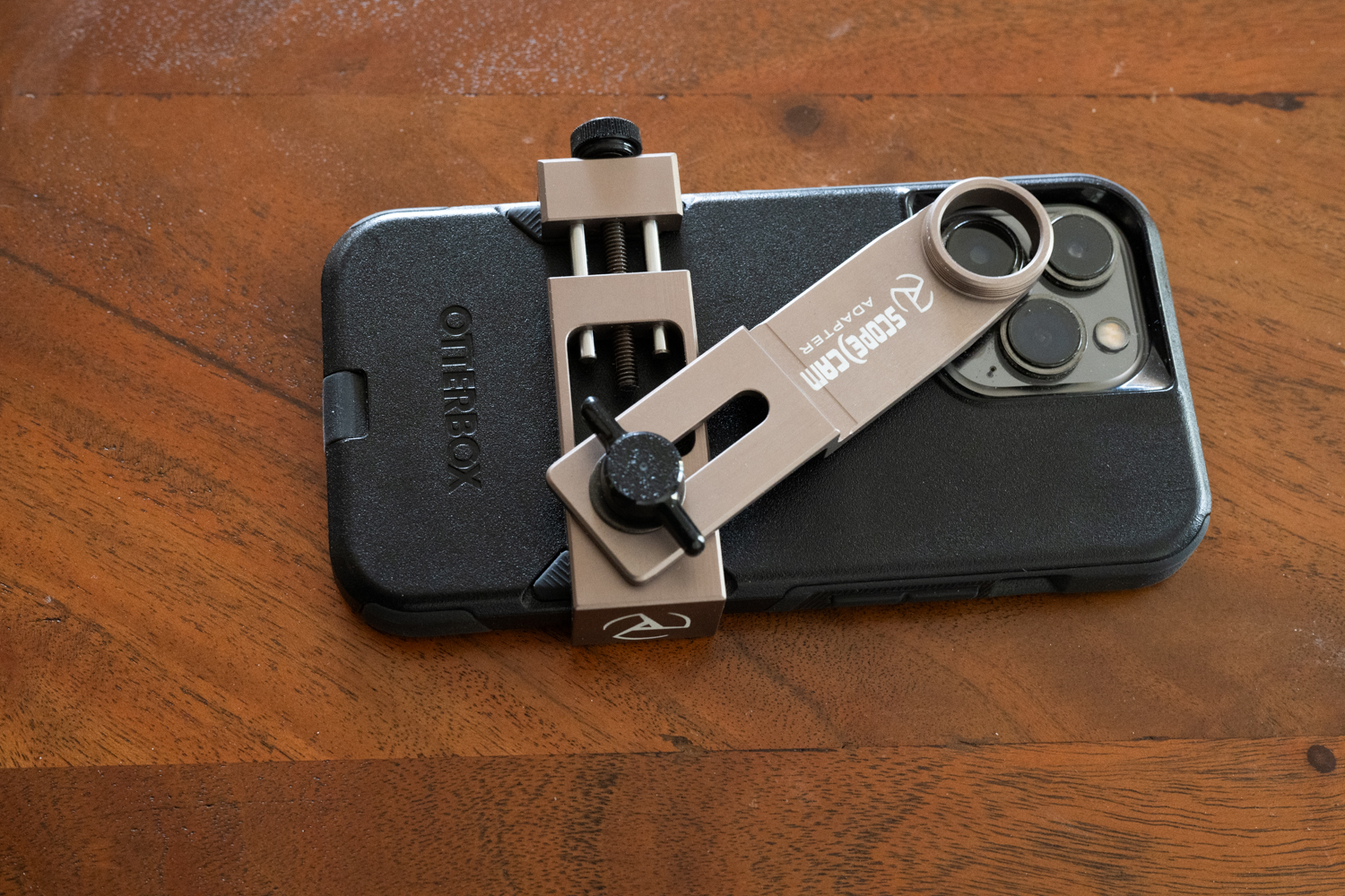 The SB-1 bracket from Scope Cam cradles any phone with or without case.