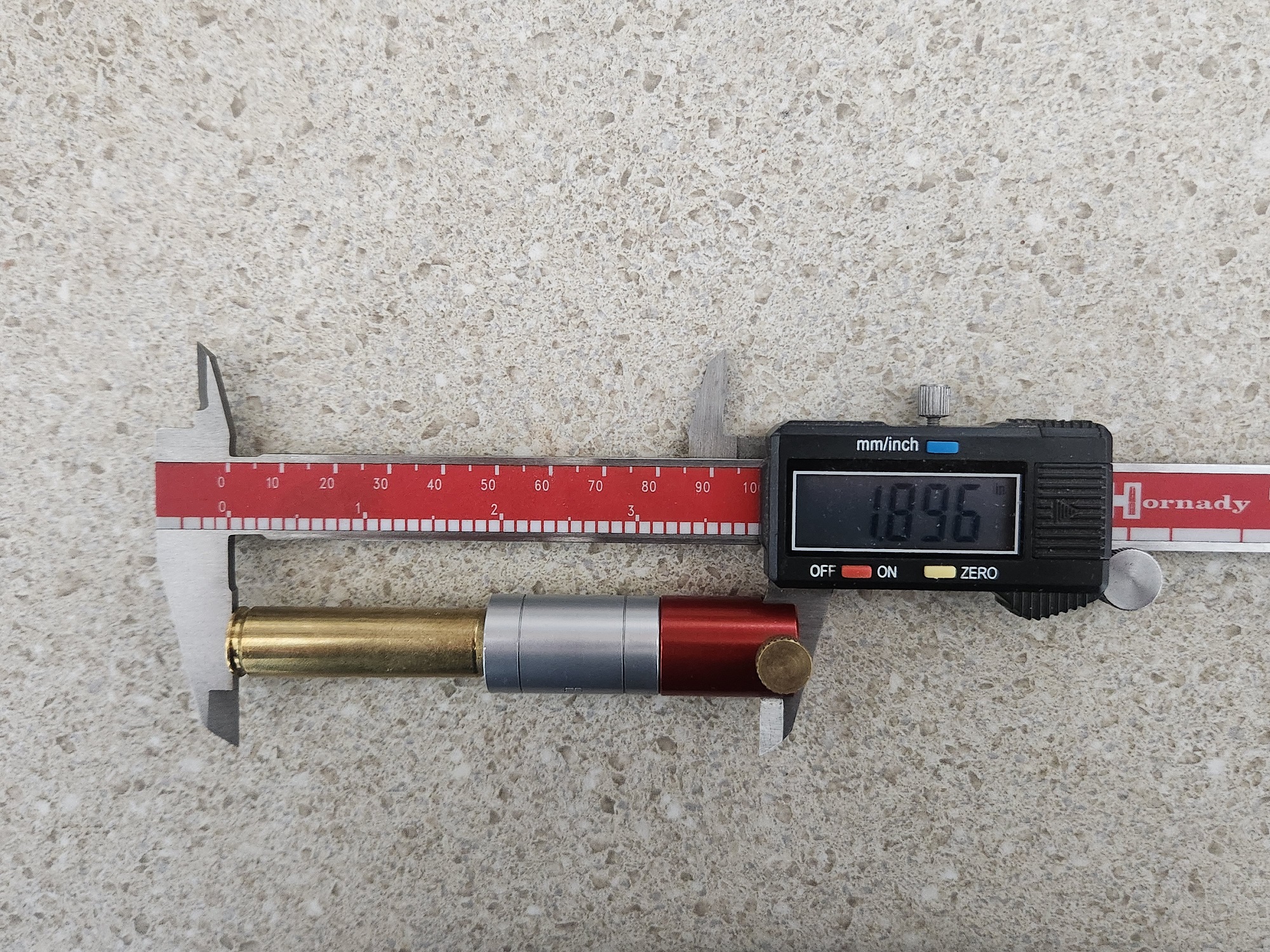 Measuring factory loaded cartridge.